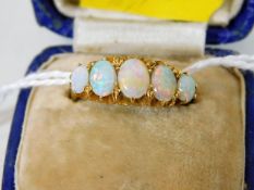 An antique 18ct gold opal ring