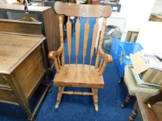 A large farmhouse style rocking chair