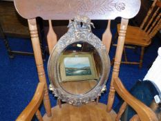 A decorative rococo style gilt framed mirror