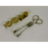 A set of brass sovereign scales & a set of white m