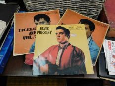 Approximately twenty Elvis Presley vinyl singles