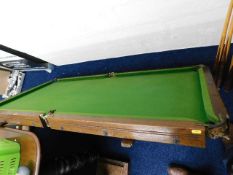 A quarter size slate bed snooker table with access