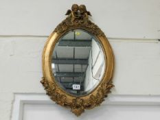 A reproduction gilt framed mirror
