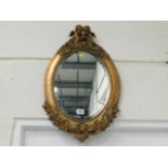 A reproduction gilt framed mirror