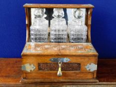 An early 20thC. oak decanter set with glass box &
