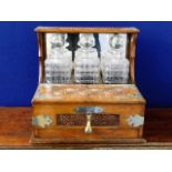 An early 20thC. oak decanter set with glass box &