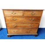 A Georgian mahogany two piece chest of drawers wit