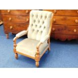A late 19thC. carved oak upholstered arm chair
