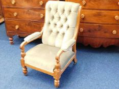 A late 19thC. carved oak upholstered arm chair