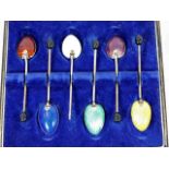 A boxed set of six silver & enamelled spoons