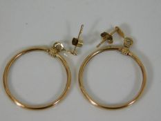 A pair of 9ct gold hooped earrings