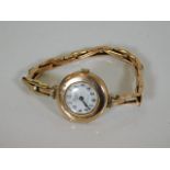 A ladies 9ct gold watch, repair to strap