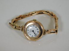A ladies 9ct gold watch, repair to strap