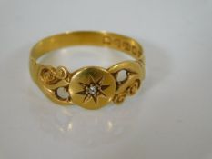 An 18ct gold antique ring set with small diamond a