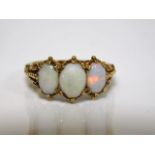 An antique 18ct gold opal trilogy ring