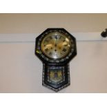 A 20thC. drop dial clock with mother of pearl styl