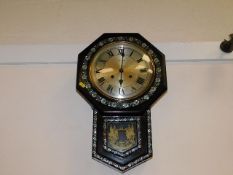 A 20thC. drop dial clock with mother of pearl styl