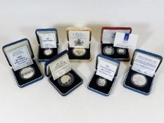 A quantity of seven boxed proof coins & sets