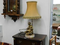 A 20thC. figurative table lamp with onyx base