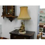 A 20thC. figurative table lamp with onyx base