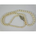 An antique set of pearls set with rose cut diamond