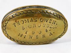 An antique brass snuff box inscribed Thomas Owen 5