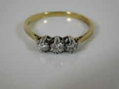 A 18ct gold diamond trilogy ring