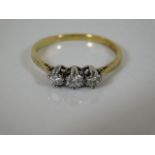 A 18ct gold diamond trilogy ring