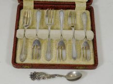 A set of six silver pastry forks with one other si