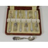 A set of six silver pastry forks with one other si