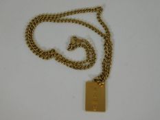 A 9ct gold chain & ingot pendant