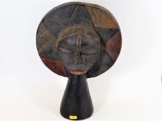 An antique Chokwe style African light wood carved tribal art mask, some remnants of paint