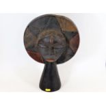 An antique Chokwe style African light wood carved tribal art mask, some remnants of paint