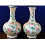 A large matched pair of Chinese porcelain vases with peach decor bearing Guangxu six figure characte
