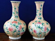 A large matched pair of Chinese porcelain vases with peach decor bearing Guangxu six figure characte
