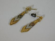 A pair of tri-colour metal art deco style earrings