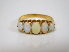 An 18ct gold five opal ring