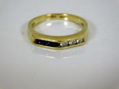 A 14k diamond & sapphire ring