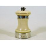 An antique silver mounted ivory pepper mill