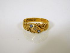 An 18ct gold antique ring set with diamond & cornf