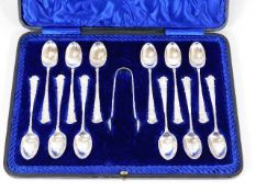 A decorative early 20thC. silver twelve spoon & to