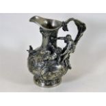 An ornate antique French pewter pitcher with birds