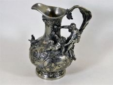 An ornate antique French pewter pitcher with birds
