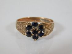 A 9ct gold ring with sapphires