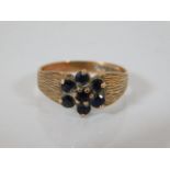 A 9ct gold ring with sapphires