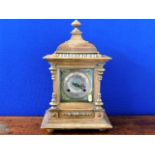 A brass faced wooden Victorian mantle clock