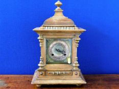 A brass faced wooden Victorian mantle clock