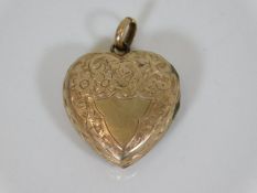 A 9ct gold locket with chased decor