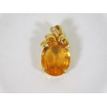 A 14ct gold mounted citrine pendant set with two s