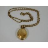 An antique 9ct gold locket & chain